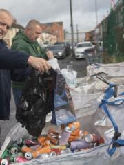 Thomas McIlhone and Damien Lindsay empty the latest donation of cans