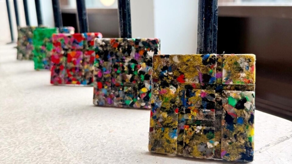 Recycled polymer tiles made from mixed rigid plastics.